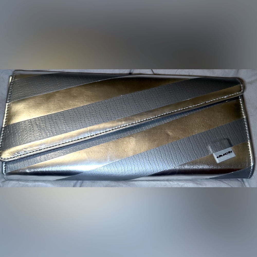 **RARE ITEM** NWOT Ducti Women’s Clutch in Silver